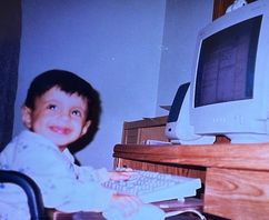 Nawaf as a toddler, smiling.